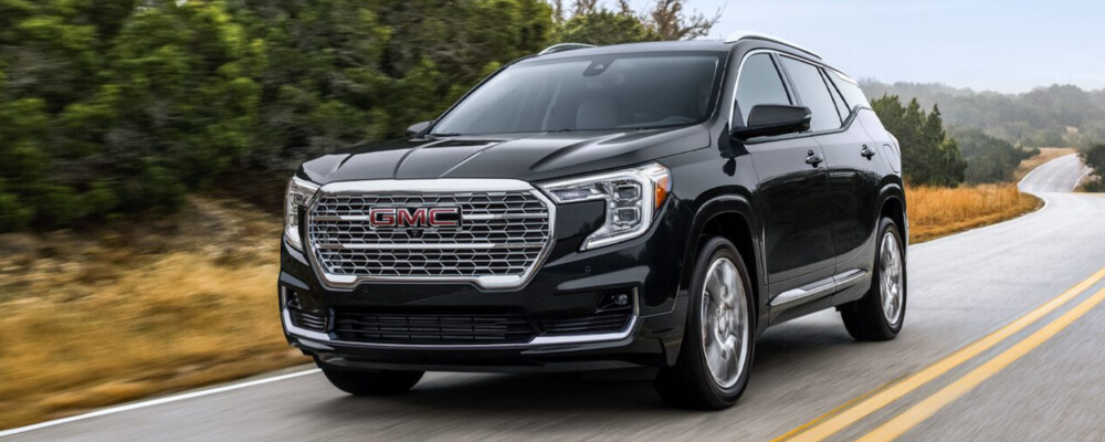 2024 GMC Terrain driving down a road