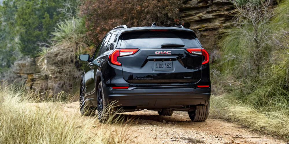 2024 GMC Terrain driving on forested path 2024 GMC Terrain driving on forested path
