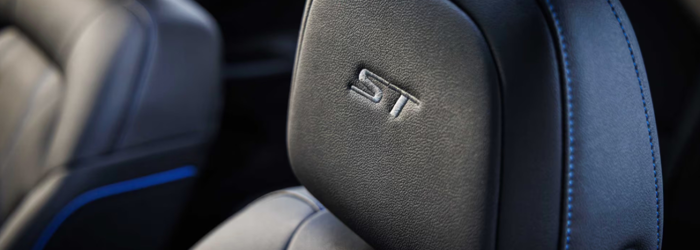 The black leather seats are stitched in royal blue.