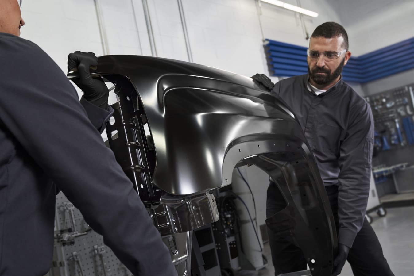 Technician working on damaged vehicle
